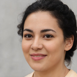 Joyful latino young-adult female with medium  brown hair and brown eyes