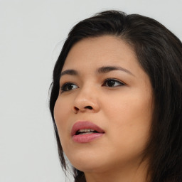 Joyful asian young-adult female with long  brown hair and brown eyes