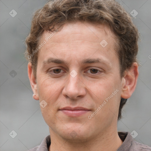 Joyful white adult male with short  brown hair and grey eyes