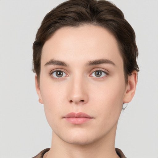 Neutral white young-adult female with short  brown hair and brown eyes