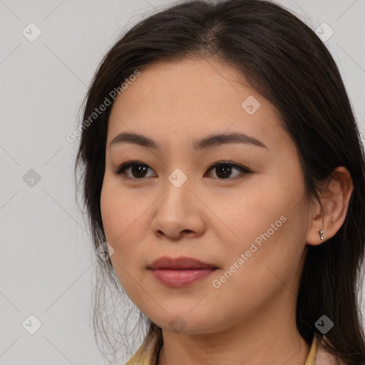 Joyful asian young-adult female with long  brown hair and brown eyes