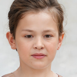 Joyful white child female with short  brown hair and brown eyes