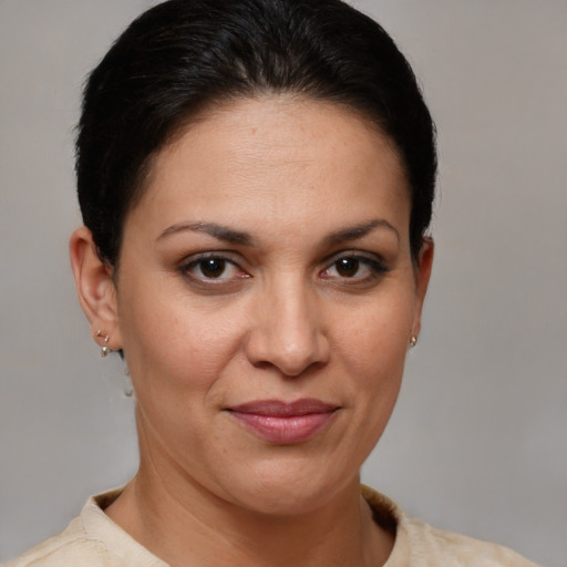 Joyful white adult female with short  brown hair and brown eyes