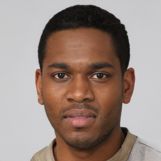 Neutral black young-adult male with short  black hair and brown eyes