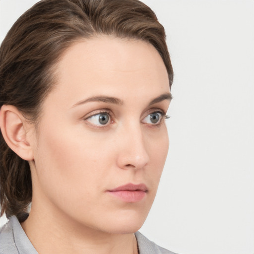 Neutral white young-adult female with medium  brown hair and grey eyes