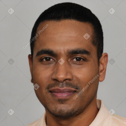 Joyful black young-adult male with short  black hair and brown eyes