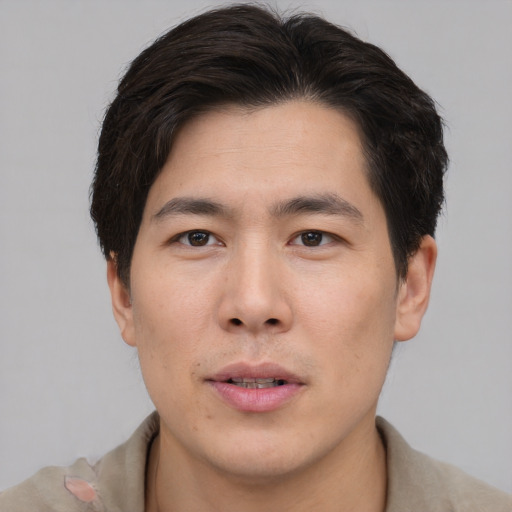 Neutral asian young-adult male with short  brown hair and brown eyes