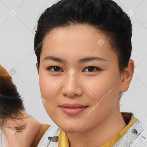 Joyful asian young-adult female with short  brown hair and brown eyes