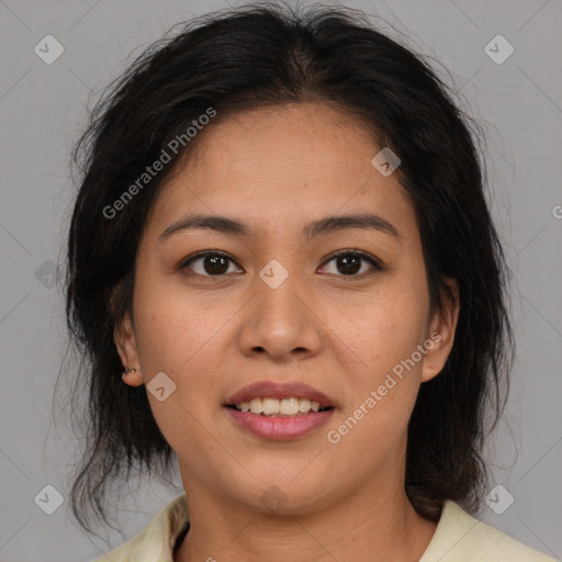 Joyful latino young-adult female with medium  brown hair and brown eyes