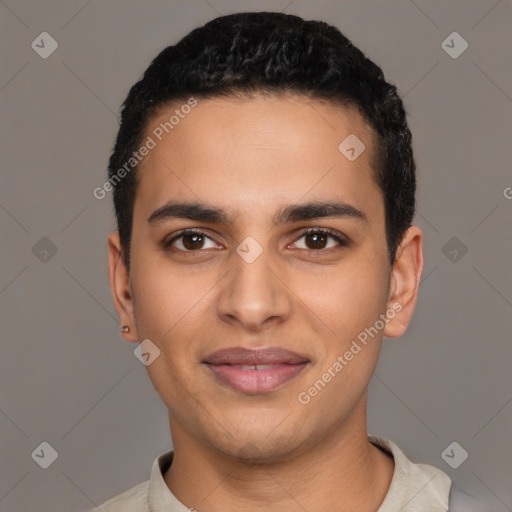 Joyful latino young-adult male with short  black hair and brown eyes