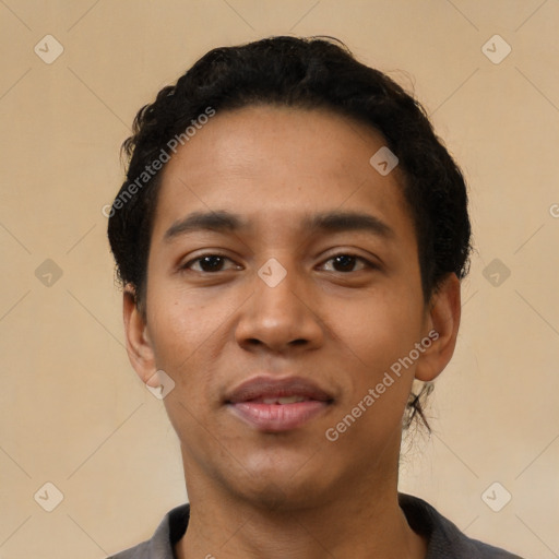 Joyful latino young-adult male with short  black hair and brown eyes