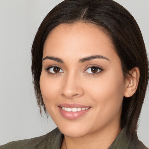 Joyful white young-adult female with long  brown hair and brown eyes