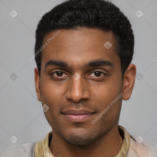 Joyful black young-adult male with short  black hair and brown eyes
