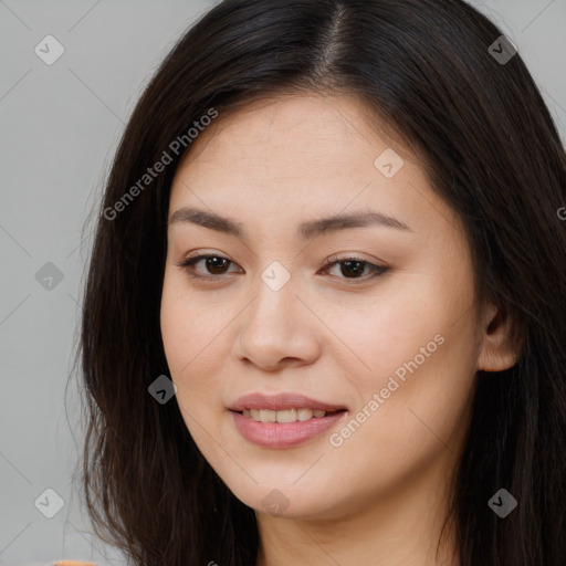 Joyful asian young-adult female with long  brown hair and brown eyes