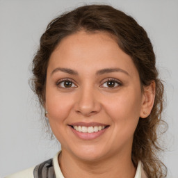 Joyful white young-adult female with medium  brown hair and brown eyes