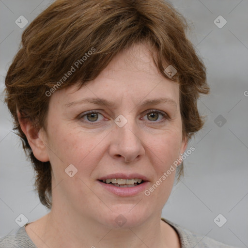 Joyful white adult female with medium  brown hair and blue eyes