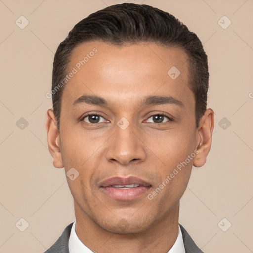 Joyful white young-adult male with short  black hair and brown eyes