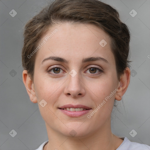 Joyful white young-adult female with short  brown hair and brown eyes