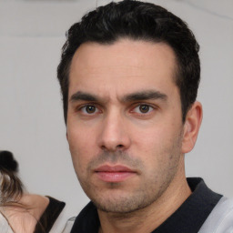 Neutral white young-adult male with short  black hair and brown eyes