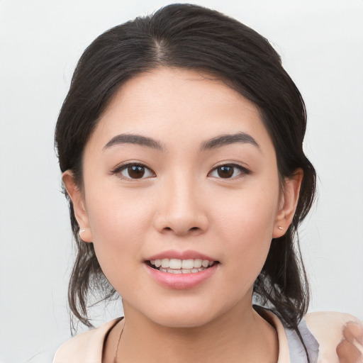 Joyful white young-adult female with medium  black hair and brown eyes