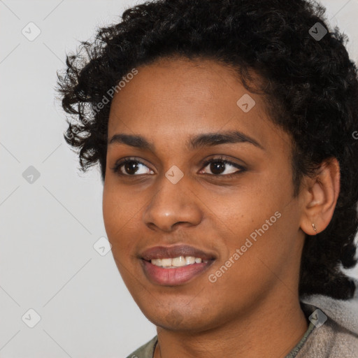 Joyful black young-adult female with short  black hair and brown eyes