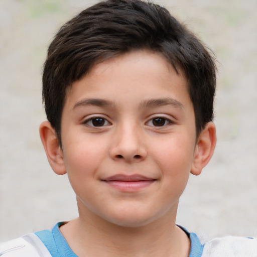 Joyful white child male with short  brown hair and brown eyes