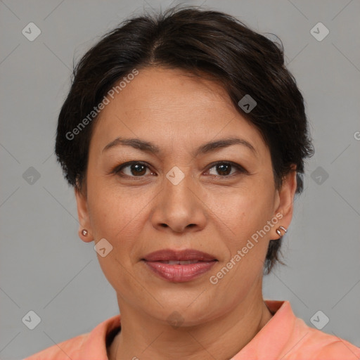 Joyful latino adult female with short  brown hair and brown eyes