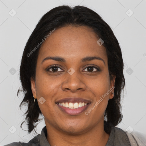 Joyful black young-adult female with medium  brown hair and brown eyes