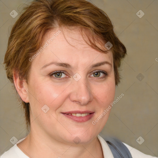 Joyful white adult female with medium  brown hair and blue eyes