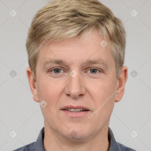 Joyful white adult male with short  brown hair and grey eyes