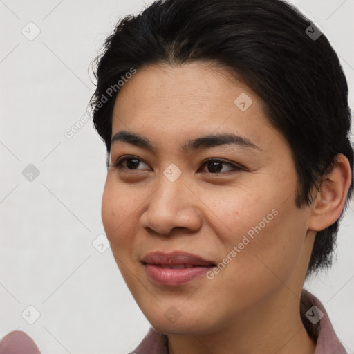 Joyful asian young-adult female with short  brown hair and brown eyes