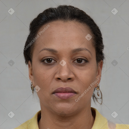 Joyful latino adult female with short  brown hair and brown eyes