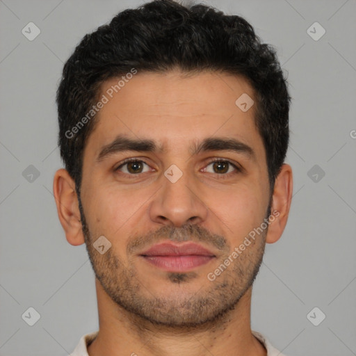 Joyful latino young-adult male with short  brown hair and brown eyes