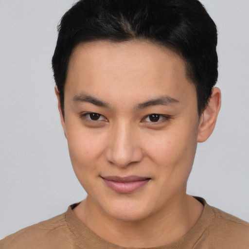 Joyful asian young-adult female with short  black hair and brown eyes