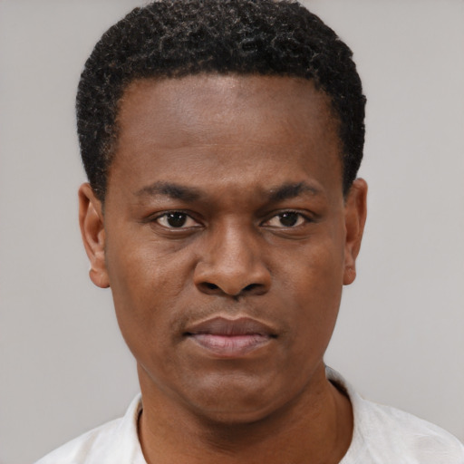 Neutral black young-adult male with short  brown hair and brown eyes