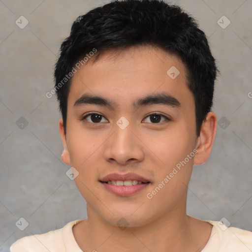 Joyful asian young-adult male with short  black hair and brown eyes