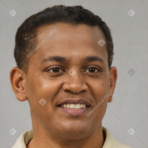 Joyful black young-adult male with short  brown hair and brown eyes