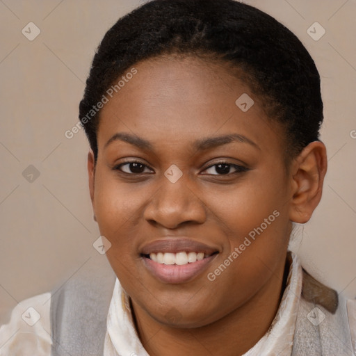 Joyful black young-adult female with short  brown hair and brown eyes