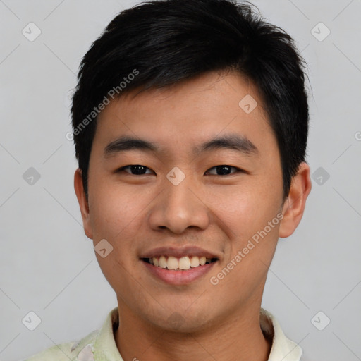 Joyful asian young-adult male with short  black hair and brown eyes