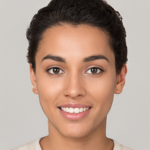 Joyful white young-adult female with short  brown hair and brown eyes