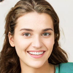 Joyful white young-adult female with long  brown hair and green eyes