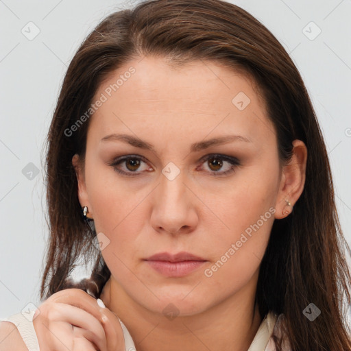 Neutral white young-adult female with long  brown hair and brown eyes