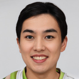 Joyful asian young-adult male with short  black hair and brown eyes