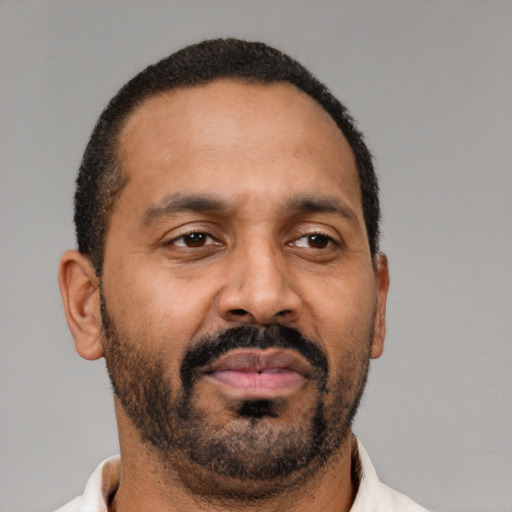 Neutral latino adult male with short  brown hair and brown eyes