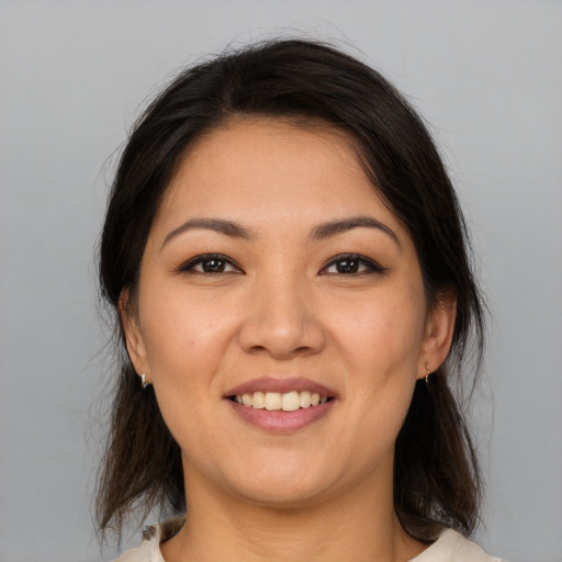 Joyful white young-adult female with medium  brown hair and brown eyes