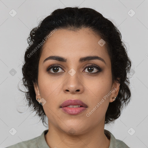 Joyful latino young-adult female with medium  brown hair and brown eyes