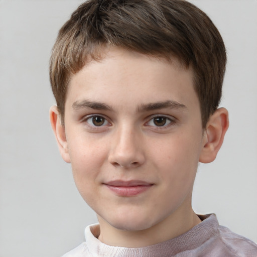 Joyful white child male with short  brown hair and brown eyes