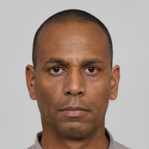 Neutral black adult male with short  black hair and brown eyes