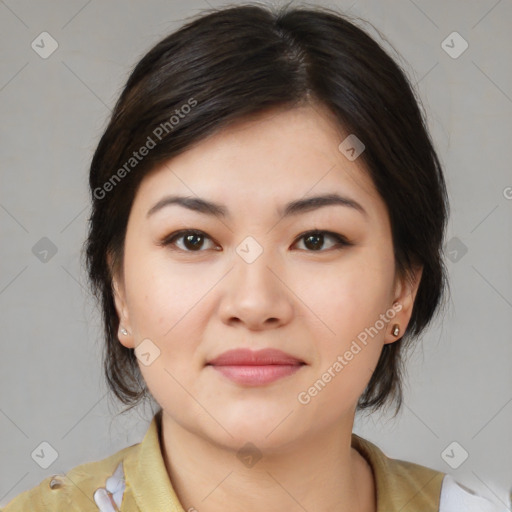 Joyful asian young-adult female with medium  brown hair and brown eyes