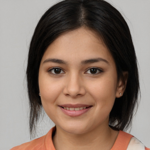 Joyful white young-adult female with medium  brown hair and brown eyes